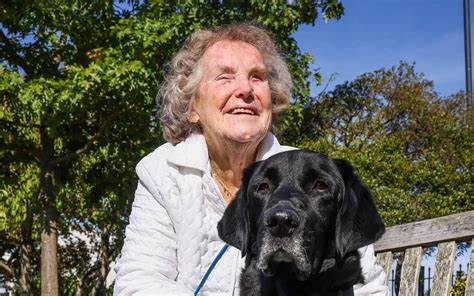 A picture of Jill Allen-King with her guide dog